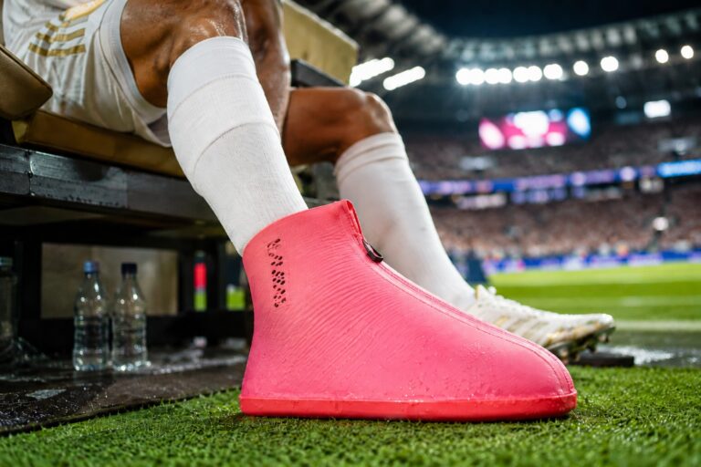 Why Are World Cup Players Wearing These Strange Boots Over Their Football Boots?